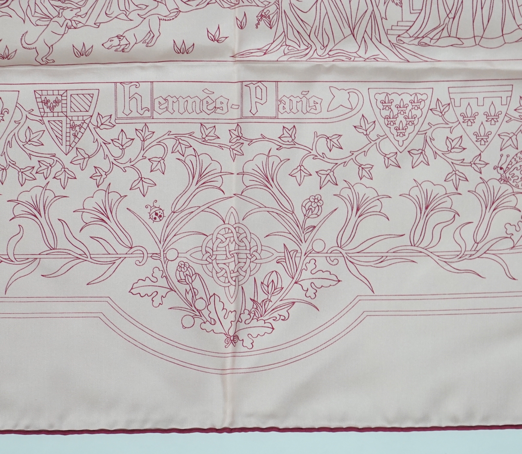 A Hermès Cavalcade de Mai printed light pink silk scarf, 90cm x 90cm
